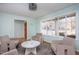 Sunlit living room featuring a large window and inviting seating area at 3615 Octavia St, Raleigh, NC 27606