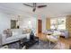 Open living room with hardwood floors, bright windows, and elegant decor at 3615 Octavia St, Raleigh, NC 27606
