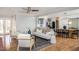 Spacious living room leading to kitchen with open concept design and hardwood floors at 3615 Octavia St, Raleigh, NC 27606