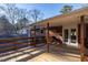 Back porch featuring a bench, cooking area, and access to the home through french doors at 3615 Octavia St, Raleigh, NC 27606
