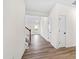 View down the hallway with stairs and doors at 420 Oak Park Blvd, Youngsville, NC 27596