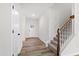 Bright foyer with stairs and wood-look flooring at 420 Oak Park Blvd, Youngsville, NC 27596