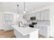 Modern kitchen with gray cabinets, white countertops, and stainless steel appliances at 420 Oak Park Blvd, Youngsville, NC 27596
