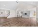 Open concept living room and kitchen with vaulted ceiling and hardwood floors at 420 Oak Park Blvd, Youngsville, NC 27596
