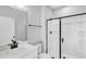 Modern bathroom featuring a glass-enclosed shower and sleek fixtures at 443 Ravensworth Dr, Garner, NC 27529