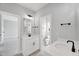 Bathroom featuring double sinks, modern hardware, and tile floors at 443 Ravensworth Dr, Garner, NC 27529