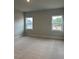 Spacious bedroom featuring plush carpets, neutral walls and two windows allowing ample natural light at 443 Ravensworth Dr, Garner, NC 27529