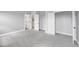 Spacious bedroom featuring neutral walls, plush carpeting, and ample closet space, ready for your personal touch at 443 Ravensworth Dr, Garner, NC 27529