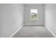 Comfortable carpeted bedroom with a bright window view at 443 Ravensworth Dr, Garner, NC 27529