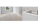 Spacious bedroom featuring plush carpeting and a window at 443 Ravensworth Dr, Garner, NC 27529