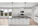 Gorgeous kitchen showcasing an island, sleek countertops, and modern finishes at 443 Ravensworth Dr, Garner, NC 27529