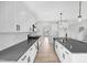 Contemporary kitchen featuring an island, stainless steel appliances, and ample cabinet space at 443 Ravensworth Dr, Garner, NC 27529