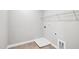 Modern laundry room with washer and dryer hookups, plus wire shelving at 443 Ravensworth Dr, Garner, NC 27529