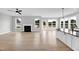 Spacious living room with fireplace, abundant windows, and open to the kitchen at 443 Ravensworth Dr, Garner, NC 27529