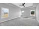 Expansive main bedroom with recessed lighting and three large windows at 443 Ravensworth Dr, Garner, NC 27529