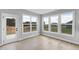 Bright sun room with large windows offering scenic views and natural light at 443 Ravensworth Dr, Garner, NC 27529