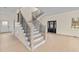 Modern staircase with metal railing and hardwood floors at 612 Lakeview Dr, Raleigh, NC 27603