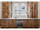 Built-in bar area with wine fridge, custom cabinets, and elegant design at 3723 Bellevue Rd, Raleigh, NC 27609