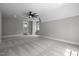 Large bedroom featuring neutral walls, carpet, modern ceiling fan and ample natural light at 3723 Bellevue Rd, Raleigh, NC 27609