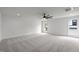 Spacious bedroom with neutral walls, carpet, modern ceiling fan and ample natural light at 3723 Bellevue Rd, Raleigh, NC 27609
