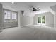 Spacious bedroom features neutral decor and an abundance of natural light from multiple windows at 3723 Bellevue Rd, Raleigh, NC 27609