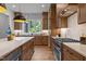 Modern kitchen with custom cabinets, marble countertops, stainless steel appliances, and a large window at 3723 Bellevue Rd, Raleigh, NC 27609