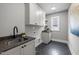 This spacious laundry room features modern appliances, stylish countertops, and ample storage options at 3723 Bellevue Rd, Raleigh, NC 27609