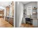 Bright office space with built-in desk, cabinets, floating shelves, and a large window for natural light at 3723 Bellevue Rd, Raleigh, NC 27609