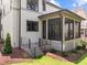 Back porch featuring railing stairs and black framed windows providing natural light at 3723 Bellevue Rd, Raleigh, NC 27609