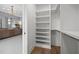 Next to the bathroom sits this large walk-in closet, complete with custom storage and shelving at 3723 Bellevue Rd, Raleigh, NC 27609