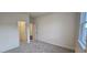 Cozy bedroom with neutral carpet, bright window and access to an attached bathroom and closet at 141 Robert Howe Dr, Fuquay Varina, NC 27526