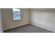 Bright bedroom with a view, offering a comfortable space with neutral finishes at 141 Robert Howe Dr, Fuquay Varina, NC 27526
