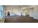 Open concept living room with recessed lighting, hardwood floors, an open flow into the kitchen, and lots of natural light at 141 Robert Howe Dr, Fuquay Varina, NC 27526