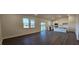 Open concept living room with lots of natural light and an open flow into the kitchen and dining area at 141 Robert Howe Dr, Fuquay Varina, NC 27526