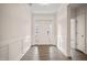 Bright entryway with hardwood floors and white wainscoting at 1539 Peabody Ct, Mebane, NC 27302