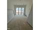 Unfinished bedroom with large windows, offering a bright space and a blank canvas for customization and design at 504 Colvard Woods Way Way, Durham, NC 27713