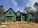 Modern two-story home with black trim being built featuring ample windows and a gabled roof at 504 Colvard Woods Way Way, Durham, NC 27713