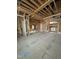 Open floor plan showcasing construction progress and large windows at 504 Colvard Woods Way Way, Durham, NC 27713