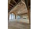 Spacious living room with high ceilings, exposed framing and large windows bringing in natural light at 504 Colvard Woods Way Way, Durham, NC 27713