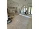 Large living room under construction with high ceilings and ample natural light from expansive windows and doors at 504 Colvard Woods Way Way, Durham, NC 27713
