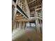 Expansive living room showcasing exposed beams, open-concept design, and lots of natural light during construction at 504 Colvard Woods Way Way, Durham, NC 27713