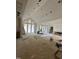 Spacious living room is under construction, featuring high ceilings and expansive windows for abundant natural light at 504 Colvard Woods Way Way, Durham, NC 27713