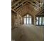 Spacious living room featuring high ceilings, large windows and an abundance of natural light at 504 Colvard Woods Way Way, Durham, NC 27713