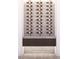 Stylish wine rack with stone accent wall, showcasing multiple bottles and a sleek wood shelf at 504 Colvard Woods Way Way, Durham, NC 27713