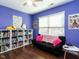 Bedroom with sofa, bookshelves and window seating at 713 Lake Artesia Ln, Fuquay Varina, NC 27526