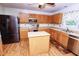 Kitchen with wood cabinets and stainless steel appliances at 119 Tadworth Ct, Mebane, NC 27302