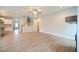 Open-concept Gathering room with kitchen and hardwood floors at 158 Abingdon Farms Dr, Selma, NC 27576