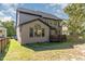 The backyard includes a deck and luscious lawn, perfect for relaxation or entertaining at 3009 Gentle Breezes Ln, Raleigh, NC 27614