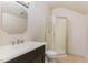 Simple bathroom featuring a glass shower and sink with dark stained vanity at 3009 Gentle Breezes Ln, Raleigh, NC 27614