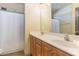 Bright bathroom with a double sink vanity and tiled floor and a white shower curtain at 3009 Gentle Breezes Ln, Raleigh, NC 27614